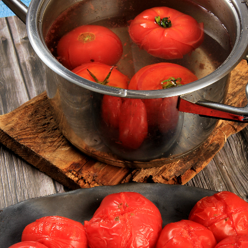 Kook de tomaten